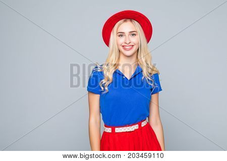 Portrait Of A Stunning Fashionable Lady In Bright Red Dress Posing Over Gray Background. Colors Of S