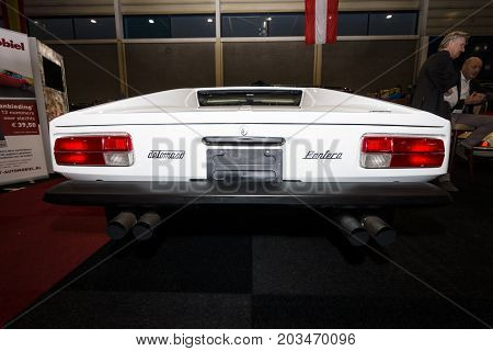 MAASTRICHT NETHERLANDS - JANUARY 09 2015: Sports car De Tomaso Pantera 1973. Rear view. International Exhibition InterClassics & Topmobiel 2015
