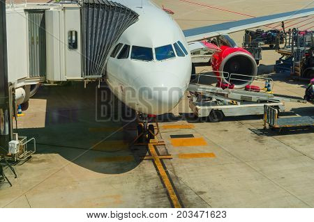 2016: Airport of Mallorca airplane in departure area during loading and refueling ready for departure.