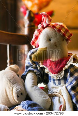 Cute Old Vintage Duck Fabric Doll On The Chair By The Window