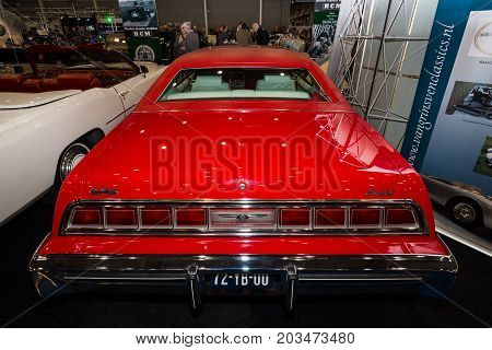 MAASTRICHT NETHERLANDS - JANUARY 09 2015: A large personal luxury coupe Ford Thunderbird (sixth generation) 1976. Rear view. International Exhibition InterClassics & Topmobiel 2015