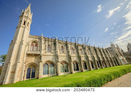 Facade of Hieronymites Monastery or Mosteiro dos Jeronimos famous Lisbon landmark in Belem district. The Monastery dos Jeronimos celebrates the return of Portuguese navigator Vasco da Gama.
