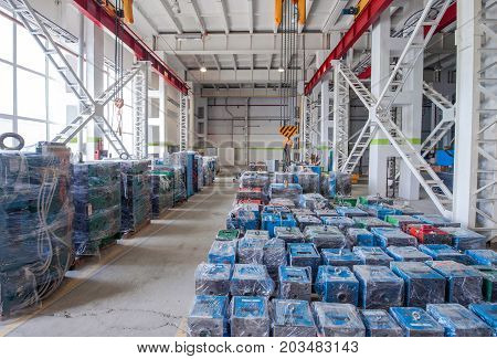 warehouse storage machines molds packed in polyethylene and hoisting crane