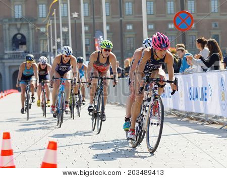 STOCKHOLM - AUG 26 2017: Group of female triathlete cyclists in the Women's ITU World Triathlon series event August 26 2017 in Stockholm Sweden