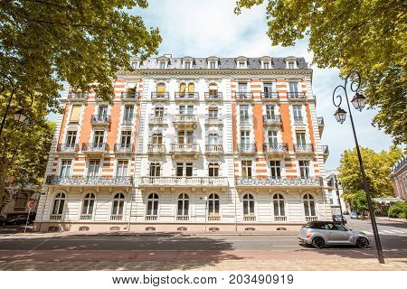 VICHY, FRANCE - August 01, 2017: View on the beautiful old residential buildings in Vichy city in the Allier department of central France