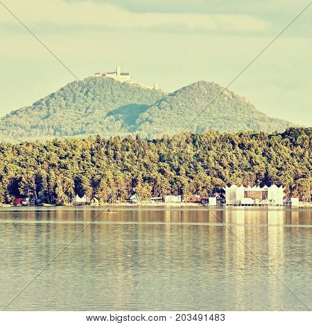 Sandy Beach By Macha's Lake With Bezdez Castle On Horizont At Sunset During Sommer Holidays In Czech