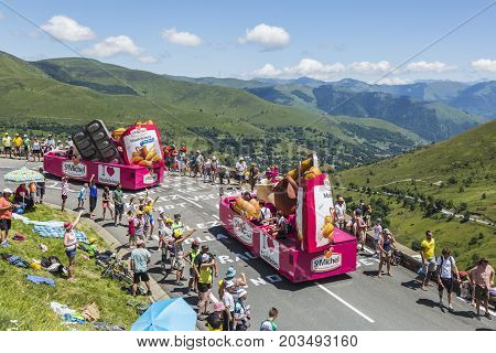 Col de PeyresourdeFrance- July 23 2014: St. Michel Madeleines vehicle passing in the Publicity Caravn on the road to Col de Peyresourde in Pyrenees Mountains during the stage 17 of Le Tour de France 2014.