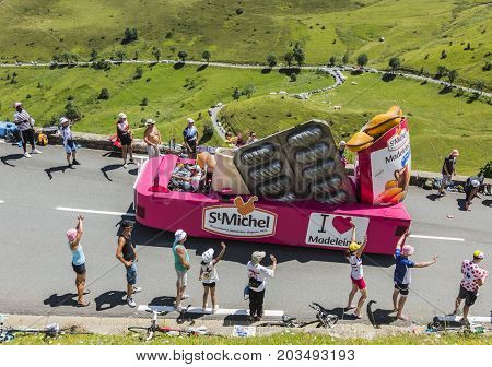 Col de PeyresourdeFrance- July 23 2014: St. Michel Madeleines vehicle passing in the Publicity Caravan on the road to Col de Peyresourde in Pyrenees Mountains during the stage 17 of Le Tour de France 2014.