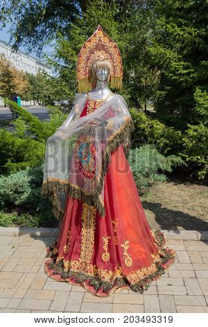 Donetsk Ukraine - August 27 2017: Samples of clothes in Russian style with the coat of arms of the USSR in the city center during the celebration of the city's day