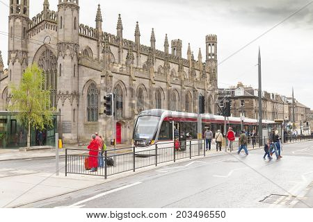 Edimburgh - August 2014 : Edinburgh Scotland in summer. some tourists go up the tram linking all the major points of interest of the city