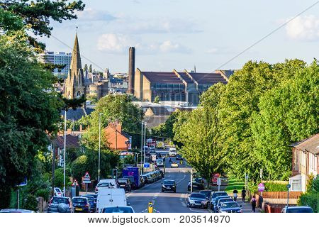 Northampton UK - Aug 15 2017: Cloudy Day Cityscape View of Northampton UK with road in foreground.