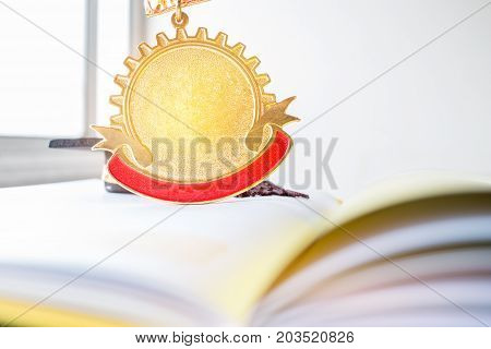 golden medals on book graduate education in university Competitions and Education study concepts. Success in study famous institution Concept of winner abroad international.