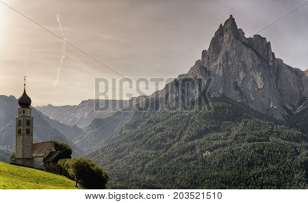 Church of St.Valentine in the morning with mountains in the background Sudtirol - Italy