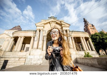 Portrait of a young woman tourist on the Haken terrace traveling in Szczecin city in Poland