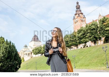 Portrait of a young woman tourist on the Haken terrace traveling in Szczecin city in Poland