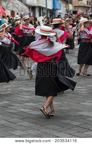 June 17 2017 Pujili Ecuador: female street dancers performing in traditional clothing at the Corpus Christi annual parade