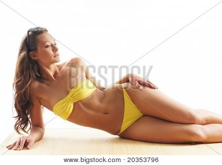Stock foto af unge, pasform og sexet kvinde i gul badedragt