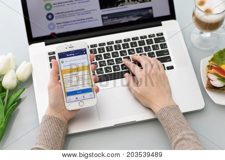 Alushta Russia - May 26 2017: iPhone with app Booking.com online hotel reservations on the screen. iPhone was created and developed by the Apple inc.