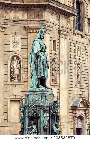 Old statue of Charles IV and St. Francis of Assissi church Prague Czech republic. Architectural theme. Photo filter.