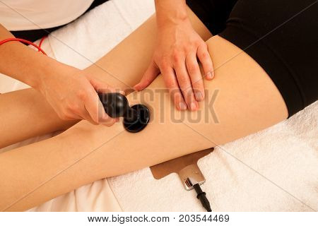Physiotherapist Doing Tecar Therapy Alterantive Treatment On A Woman Patient