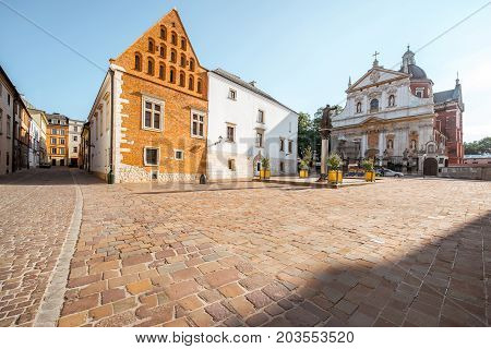 View on the square of Saint Mary Magdalene with saint Peter and Paul church in Krakow during the sunrise in Poland