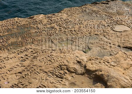 Carved And Engraved Names In The Rock