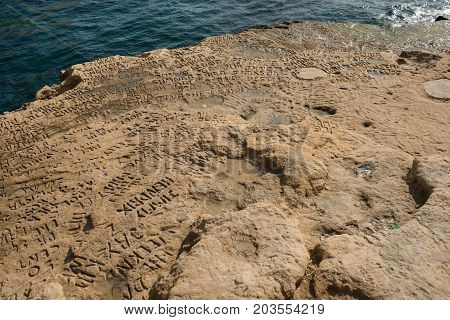 Carved And Engraved Names In The Rock