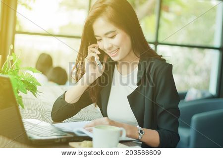 Businessmen And Women Are Using Mobile And Touch Smart Phone For Communication And Checking On Busin