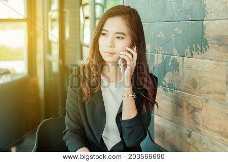 Businessmen And Women Are Using Mobile And Touch Smart Phone For Communication And Checking On Busin