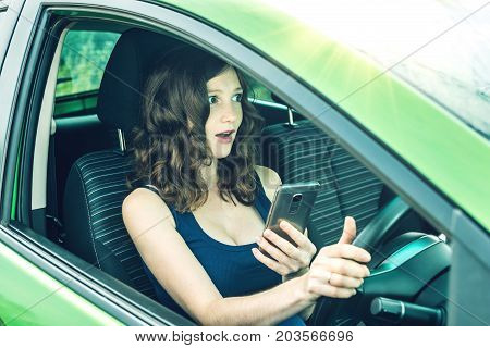Driver Woman With A Phone In Hands Makes An Accident. Fright, Inconsiderate And Dangerous Driving. T
