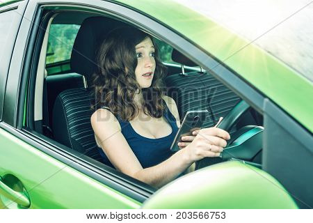 Driver Woman With A Phone In Hands Makes An Accident. Fright, Inconsiderate And Dangerous Driving. T