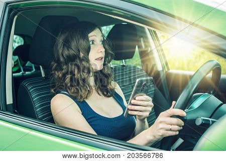 Driver Woman With A Phone In Hands Makes An Accident. Fright, Inconsiderate And Dangerous Driving. T