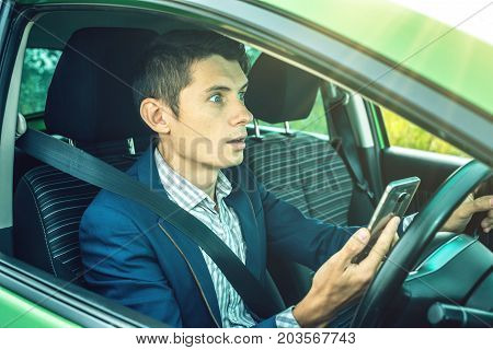 Driver Man With A Phone In Hands Makes An Accident. Fright, Inconsiderate And Dangerous Driving. The