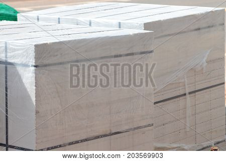 White cement blocks for construction and industry.