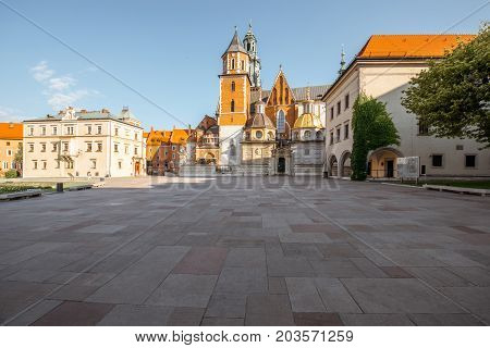 KRAKOW, POLAND - August 15, 2017: View on the inner courtyard of Wawel castle with chapels and Basilica of saint Stanislaus and Wenceslaus during the sunny morning in Krakow