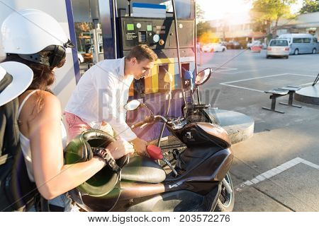 Man And Woman Motorcyclists Motorcycle On Station Young Couple Pertol Bike