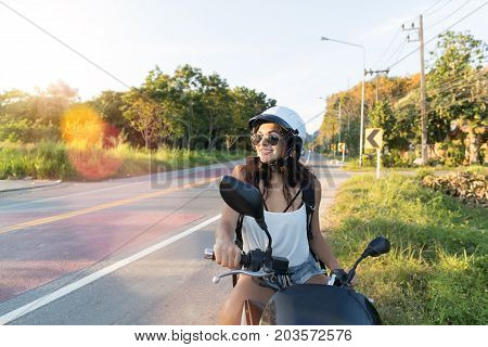 Attractive Woman On Motorcycle Wear Helemt On Countryside Road Pretty Woman Motorcyclist Travel On Motorbike Summer Trip Concept