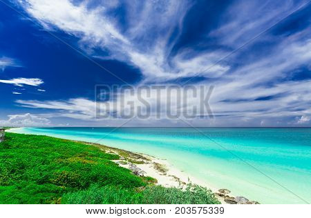 gorgeous amazing, beautiful, stunning view of tropical white sand beach and tranquil turquoise tender ocean on sunny summer day and blue magic deep, blue sky background at Santa Maria island,Cuba