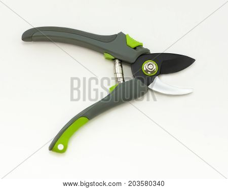 Open new professional secateur or garden pruner close up isolated on white background. Top view