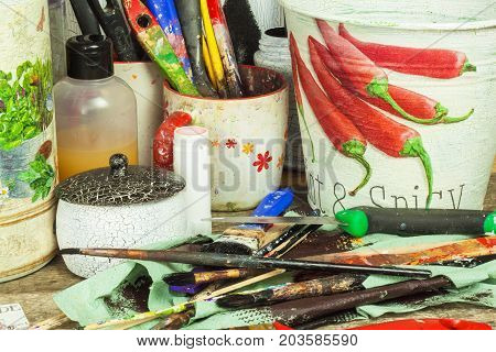 BRNO CZECH REPUBLIC -10 September 2017: Products made by decoupage technique. Decoupage is a technique of decorating items napkins. Workshop of the painter. Work desk mess