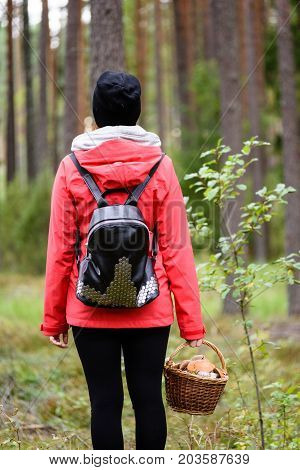 Young Woman In Red Jacket Enjoying Nature In Forest. Latvia
