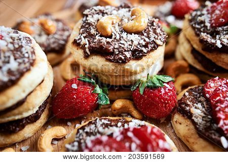 Vegan Homemade Coconut Cookies With Strawberries And Chocolate Nut Toping, Close Up