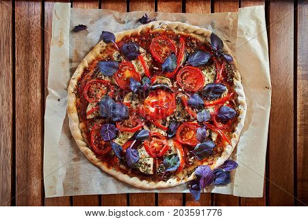 Home Made Vegan Pizza With Mushrooms, Tomatoes, Basil, Peppers And Aubergines - Thin Pastry Crust At