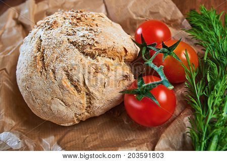 Wholegrain Brioches Made With Coriander Seeds And Tomatoes, Served On Paper And Wooden Tray; Close U