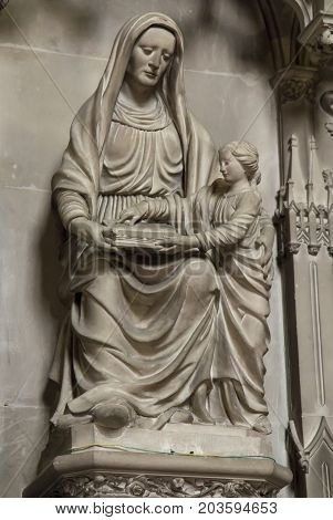 Poitiers France - September 12 2016: Very old church Notre Dame la Grande in Poitiers France in the interior of one of the side altars with a statue of the Virgin Mary with Jesus