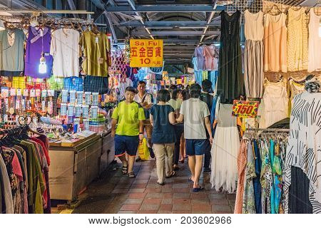 TAIPEI TAIWAN - JULY 02: This is a street in Jingmei night market where many locals come to shop. The shops sell clothes and other items at cheap prices on July 02 2017 in Taipei