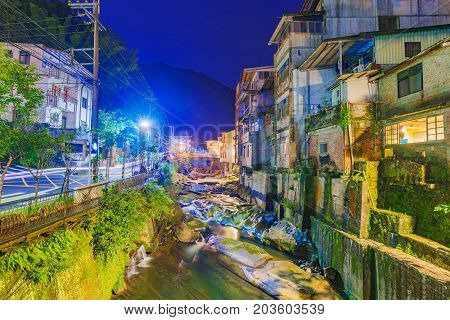 Shiding old street architecture and river view at night