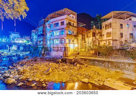 Riverside homes at night in rural village in Taiwan