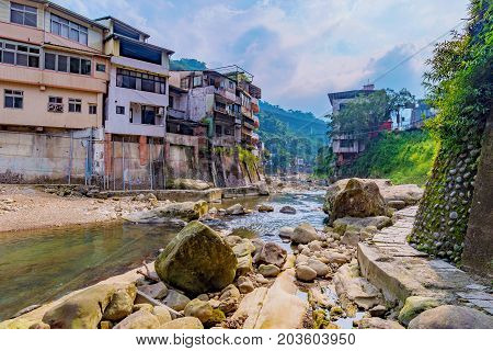 Scenic view of river and old buildings in Shiding district