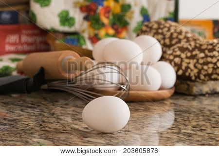 Eggs bread and ingredients prepare for cooking on marble table.
